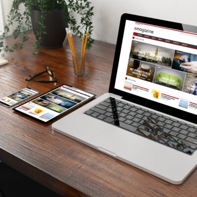 devices e-magazine on wooden desktop 3d rendering