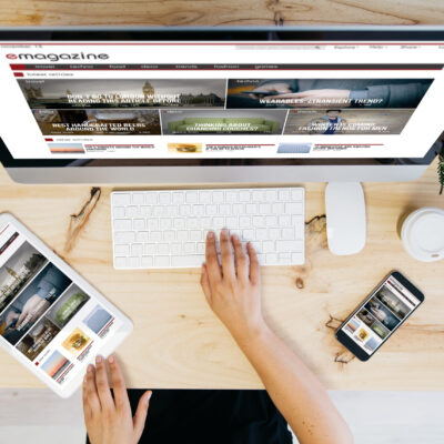overhead desktop with e-magazine on devices screen